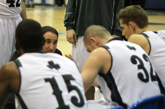 Photo by Ethan Magoc: Mercyhurst College coach Gary Manchel discusses a play with his team during a second half timeout against Clarion University on Wednesday, Jan. 19, 2011, at the Mercyhurst Athletic Center.